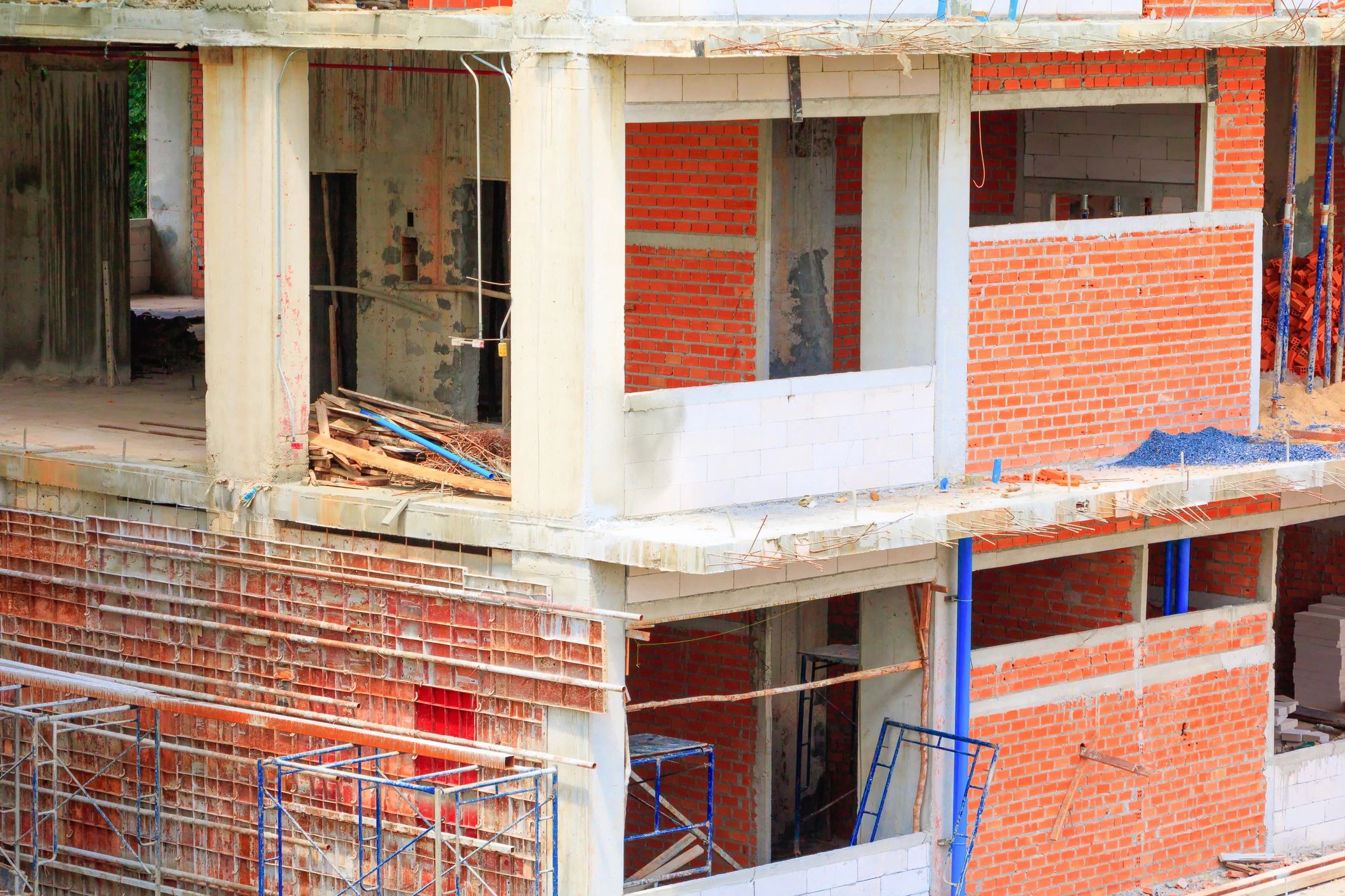 Renovation project with open walls and exposed beams